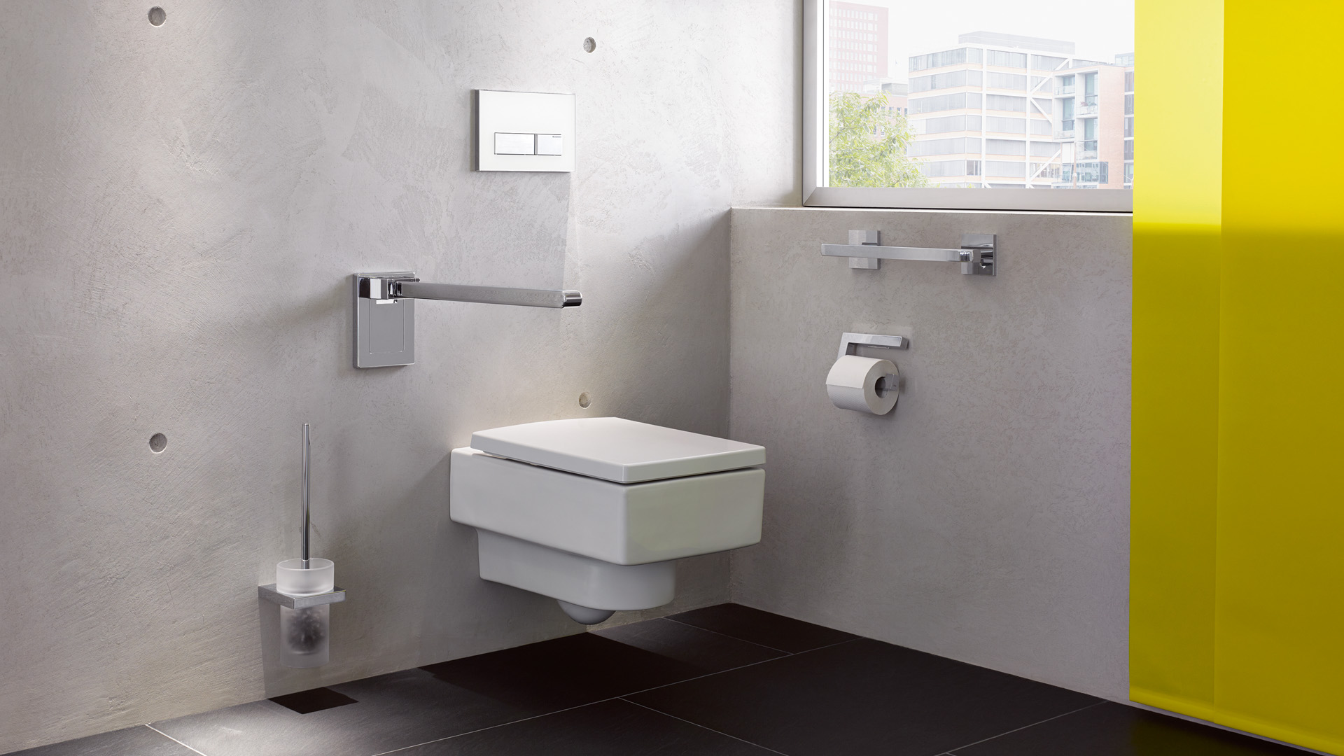 Hewi-Systemlösungen für die Toilette: Stützklappgriff, WC-Bürstengarnitur, Haltegriff, WC-Papierrollenhalter